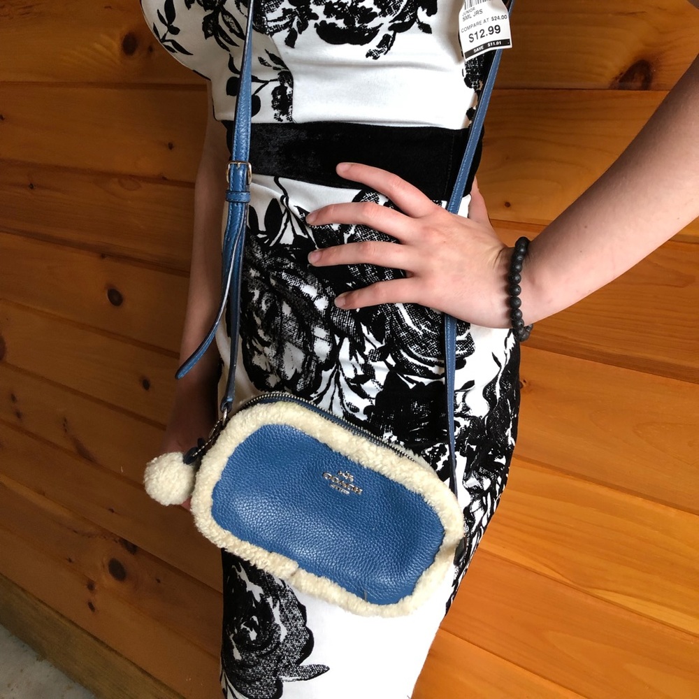 Beautiful navy blue COACH bag with fur.